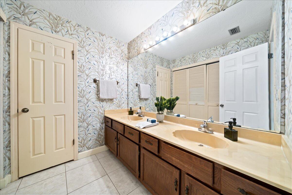 271 Sandy Run Melbourne, FL 32940 - Photo 24 of 41 a bathroom with a double vanity sink mirror and
