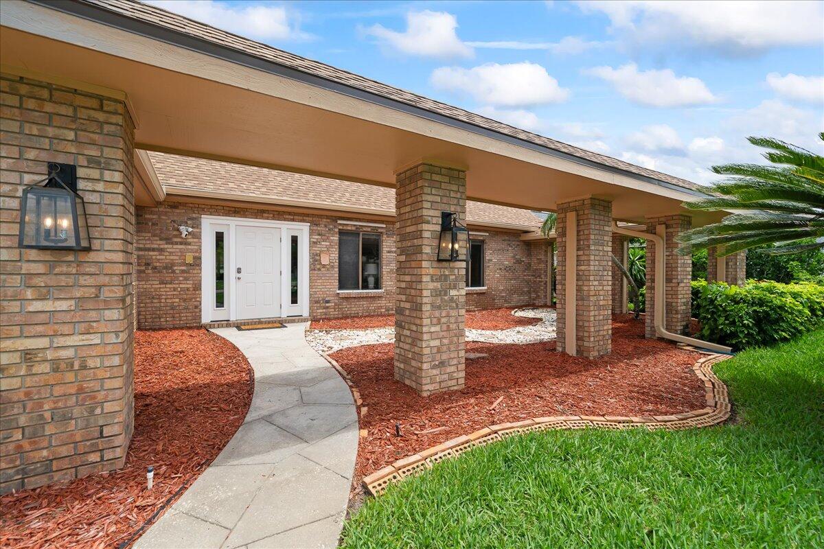271 Sandy Run Melbourne, FL 32940 - Photo 4 of 41 a front view of a house with a yard