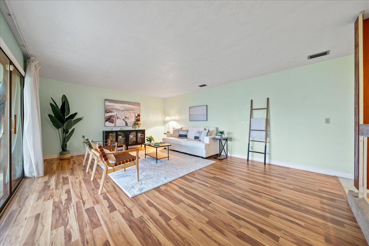 271 Sandy Run Melbourne, FL 32940 - Photo 8 of 41 a living room with furniture and a wooden floor
