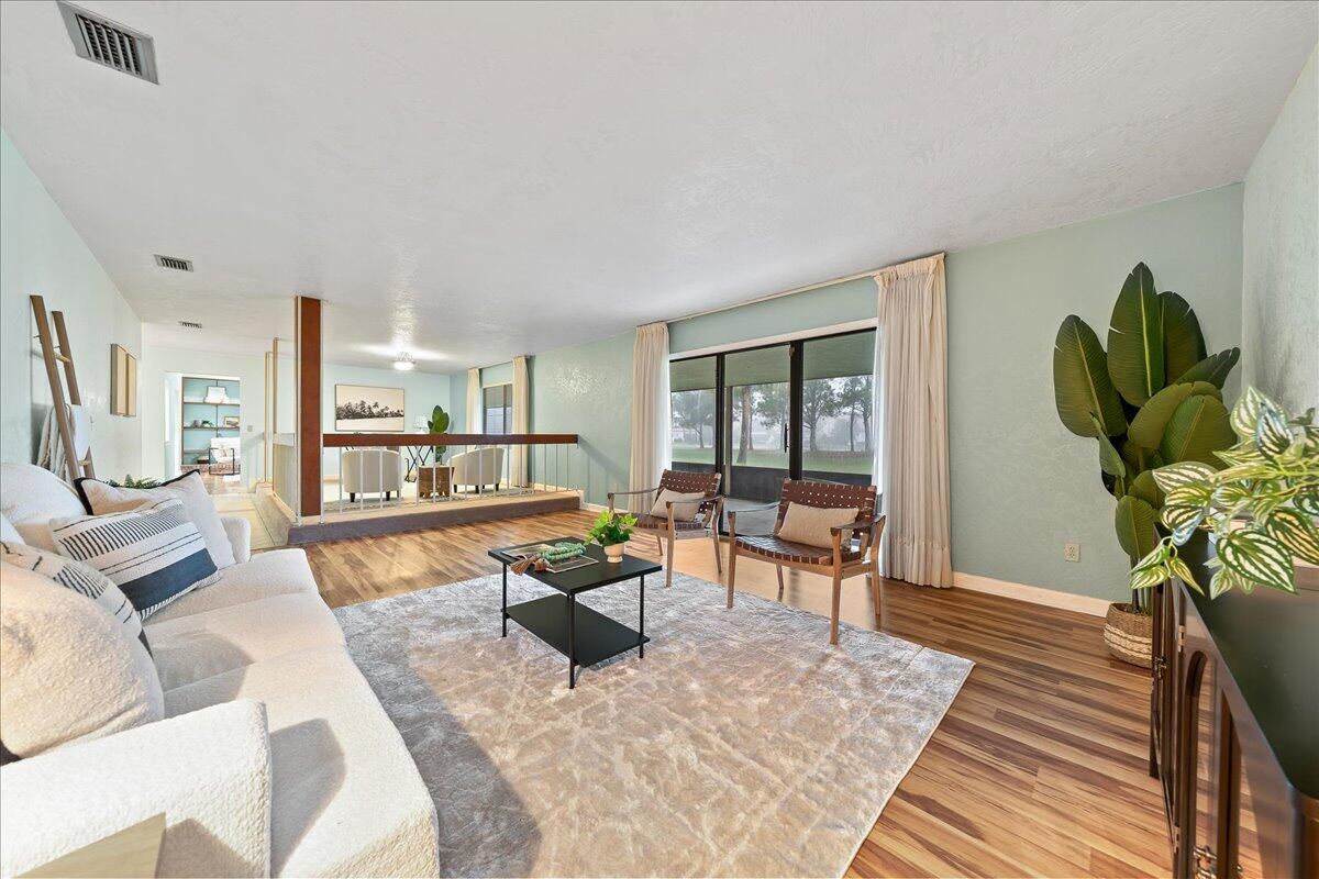 271 Sandy Run Melbourne, FL 32940 - Photo 9 of 41 a living room with furniture and a wooden floor
