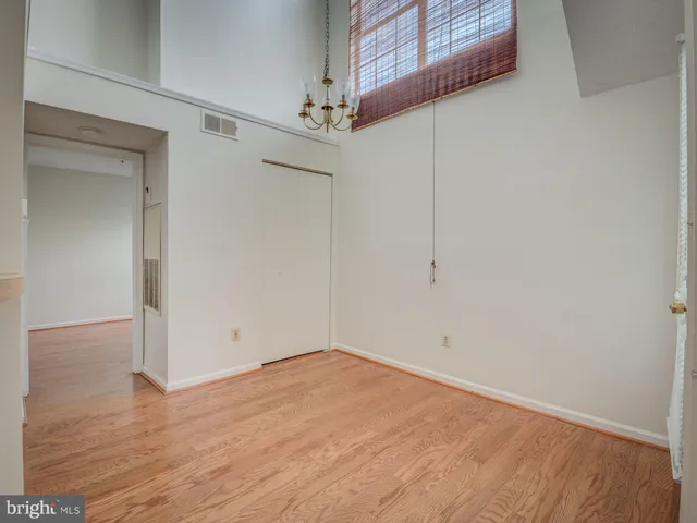 an empty room with wooden floor