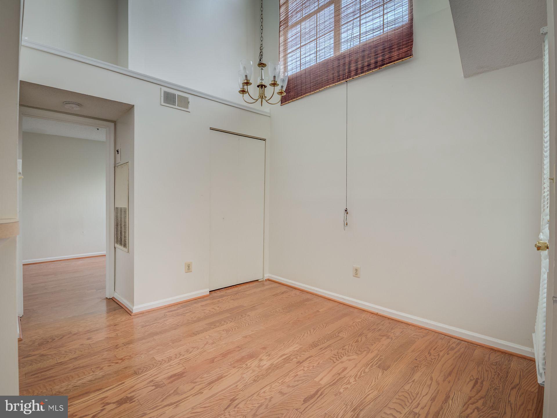 14059 Vista Drive, Unit 141 Laurel, MD 20707 - Photo 12 of 33 an empty room with wooden floor