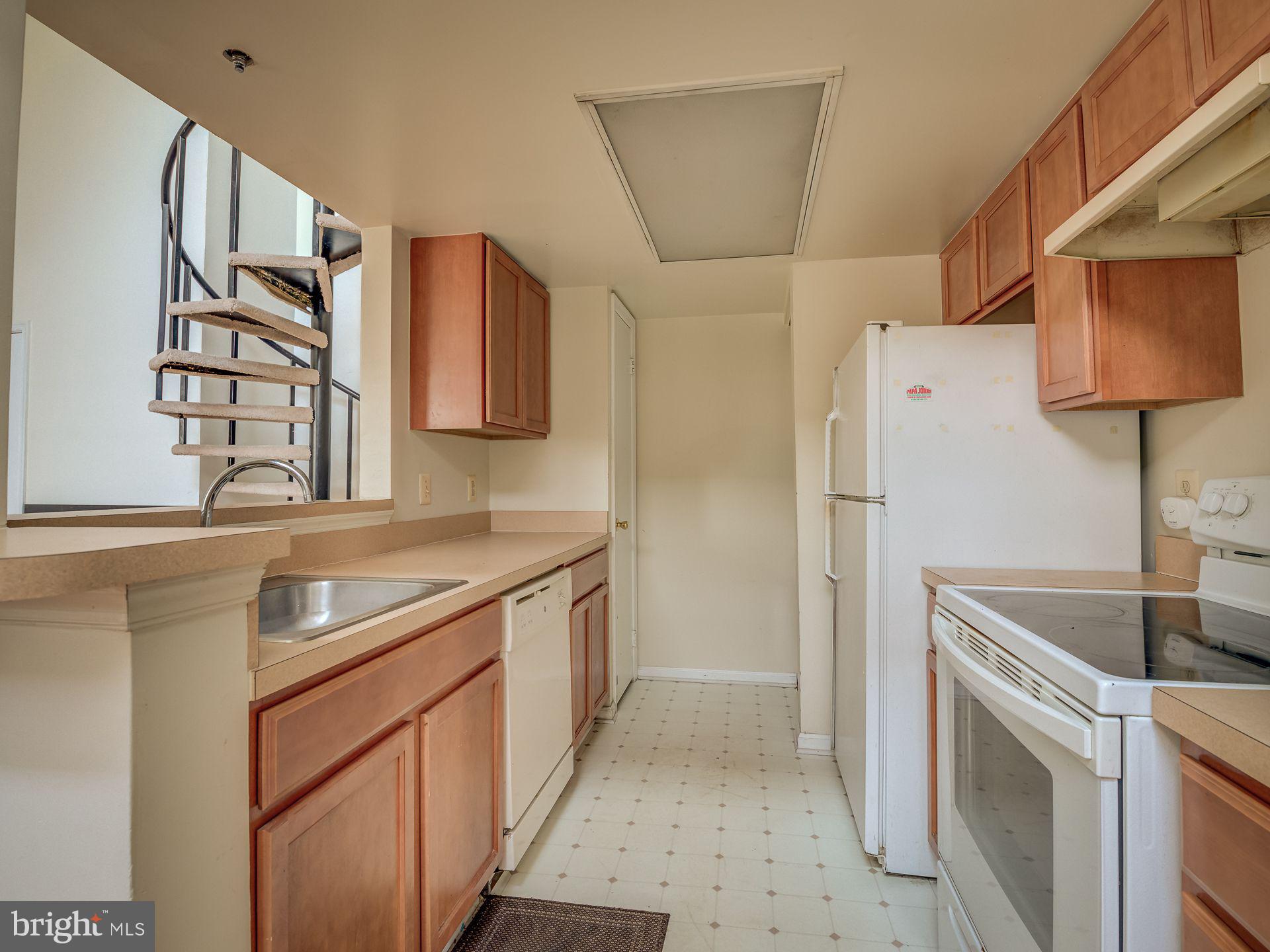 14059 Vista Drive, Unit 141 Laurel, MD 20707 - Photo 16 of 33 a kitchen with stainless steel appliances granite countertop a sink stove and refrigerator