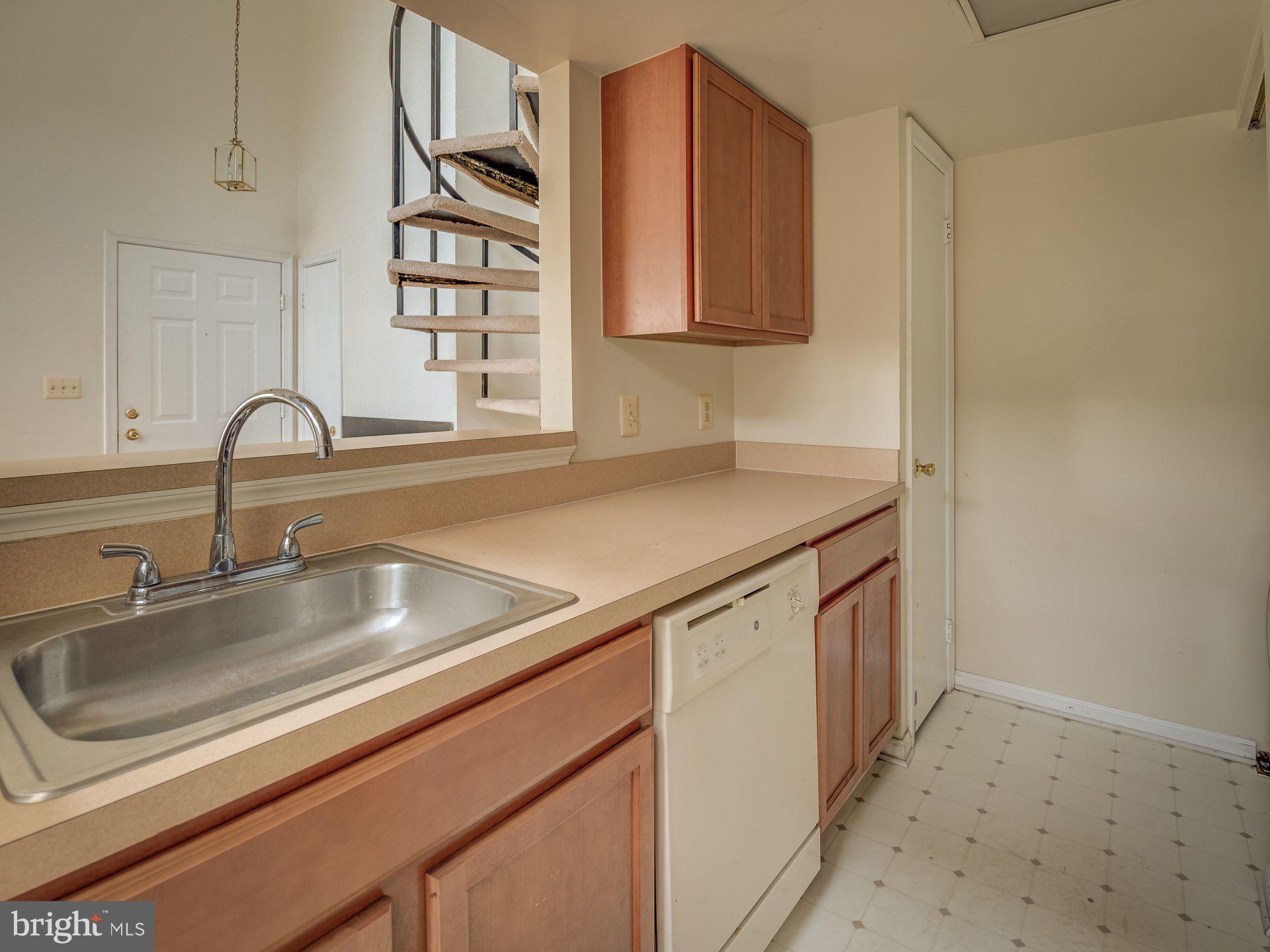 14059 Vista Drive, Unit 141 Laurel, MD 20707 - Photo 18 of 33 a kitchen with stainless steel appliances granite countertop a sink and a microwave