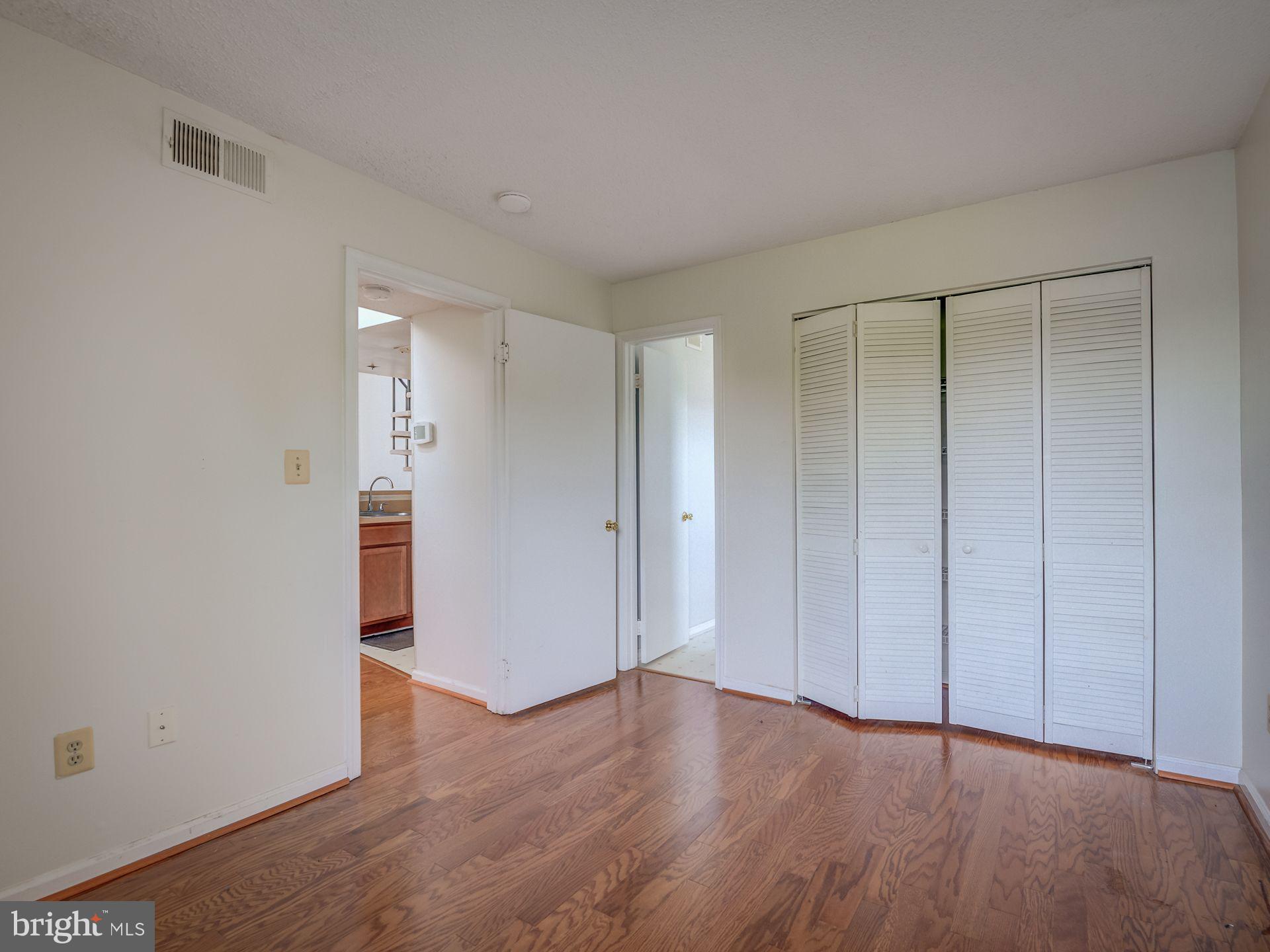 14059 Vista Drive, Unit 141 Laurel, MD 20707 - Photo 26 of 33 a view of an empty room with wooden floor