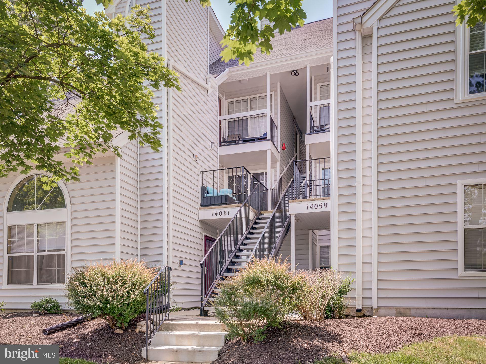 14059 Vista Drive, Unit 141 Laurel, MD 20707 - Photo 4 of 33 a house that has a tree in front of the house
