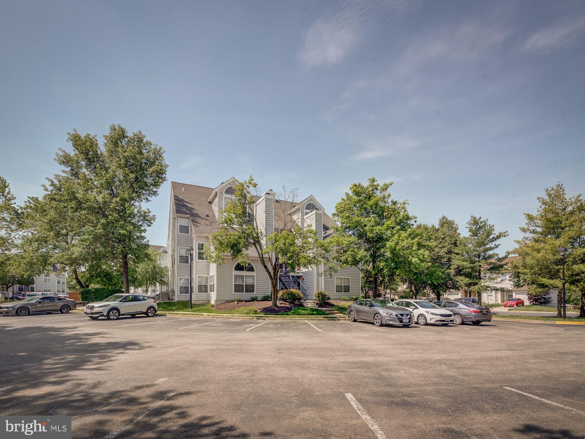 14059 Vista Drive, Unit 141 Laurel, MD 20707 - Photo 5 of 33 a view of a road with a building in the background