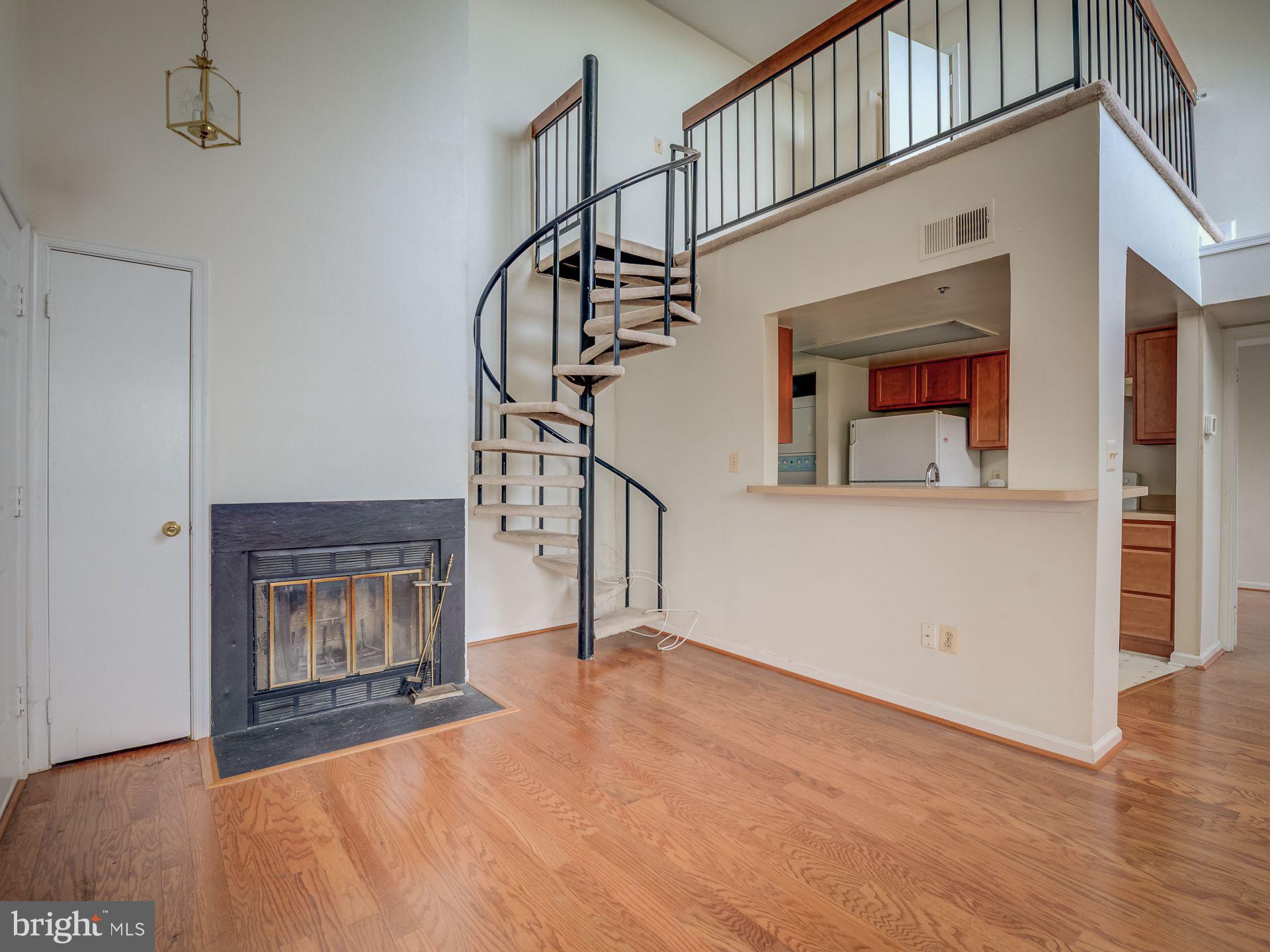 14059 Vista Drive, Unit 141 Laurel, MD 20707 - Photo 8 of 33 a view of an empty room and wooden floor