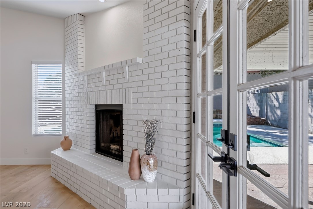 434 Crestway Road Henderson, NV 89015 - Photo 22 of 46 Detailed view of a fireplace, wood finished floors, and french doors