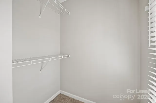 a view of an empty walk in closet