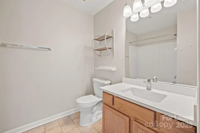 a bathroom with a sink a toilet and vanity