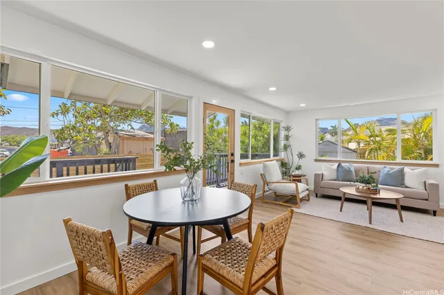 a outdoor dining space with furniture and garden view