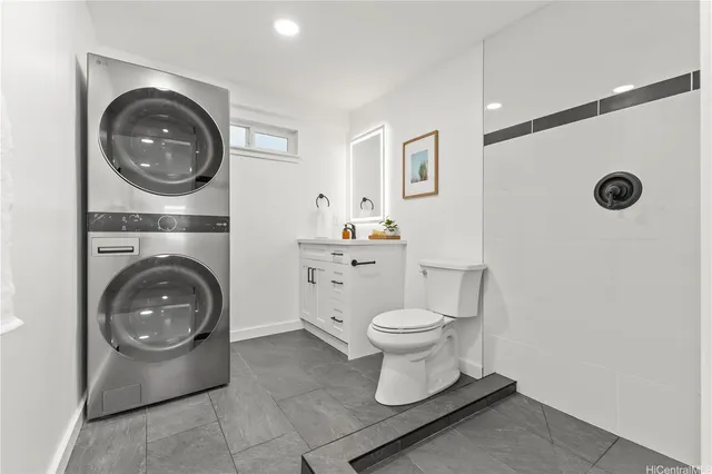 a bathroom with a toilet a sink and a mirror