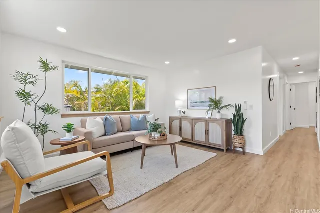 a living room with furniture and a large window