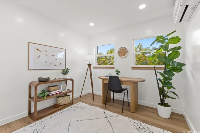 a workspace with furniture and painting on the wall