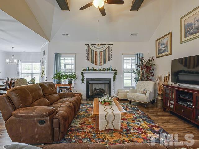 40 Fisher Road Lillington, NC 27546 - Photo 15 of 47 a living room with furniture fireplace and a flat screen tv