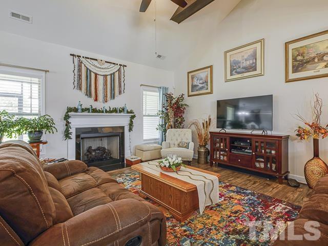 40 Fisher Road Lillington, NC 27546 - Photo 16 of 47 a living room with furniture and a flat screen tv