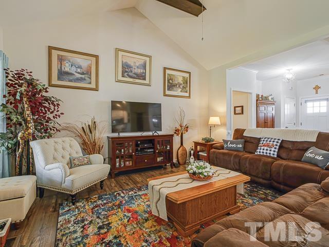 40 Fisher Road Lillington, NC 27546 - Photo 17 of 47 a living room with furniture and a flat screen tv