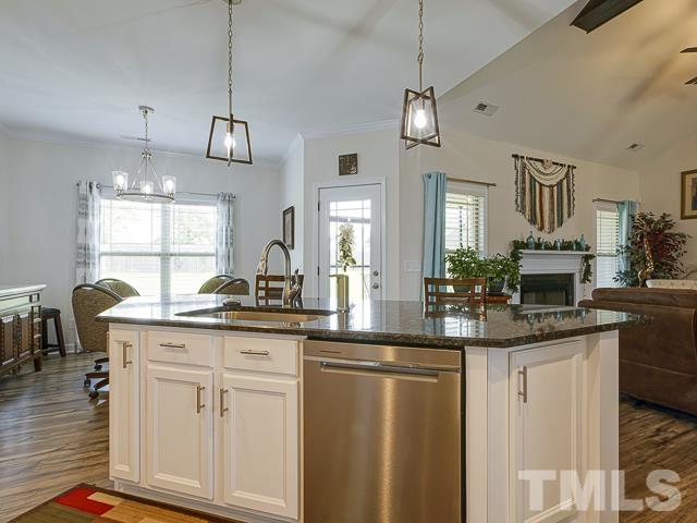 40 Fisher Road Lillington, NC 27546 - Photo 22 of 47 a kitchen with center island and cabinets