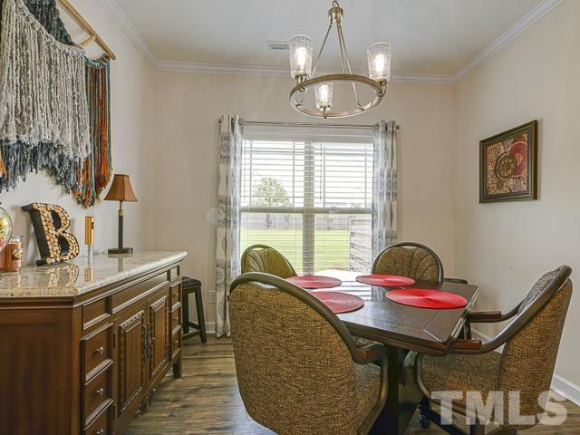 40 Fisher Road Lillington, NC 27546 - Photo 25 of 47 a view of a dining room with furniture window and outside view