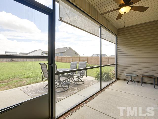 40 Fisher Road Lillington, NC 27546 - Photo 28 of 47 a view of a glass door with a floor to ceiling window