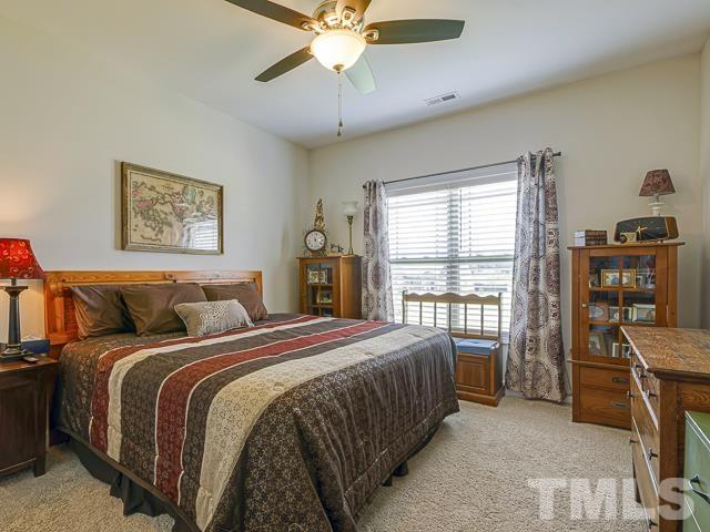 40 Fisher Road Lillington, NC 27546 - Photo 35 of 47 a bed room with a bed and a window
