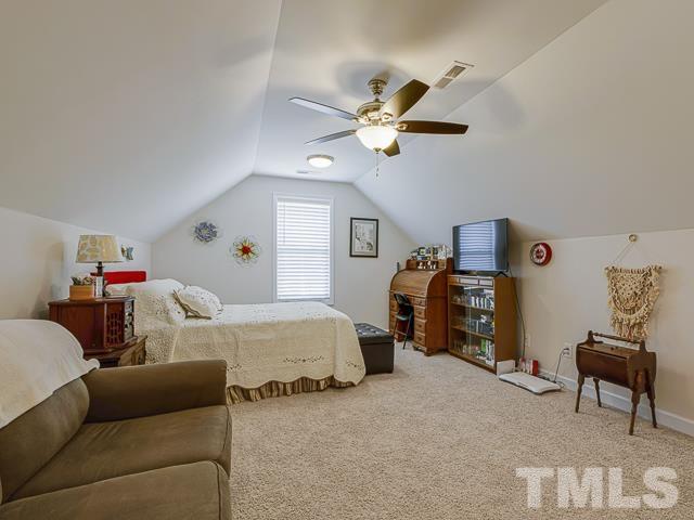 40 Fisher Road Lillington, NC 27546 - Photo 43 of 47 a bedroom with furniture and a window