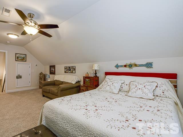 40 Fisher Road Lillington, NC 27546 - Photo 44 of 47 a bedroom with a large bed and a bed