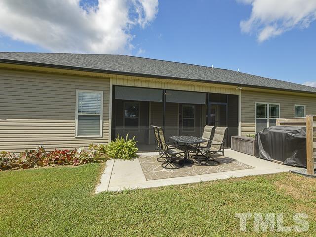 40 Fisher Road Lillington, NC 27546 - Photo 46 of 47 a front view of a house with sitting area and garden