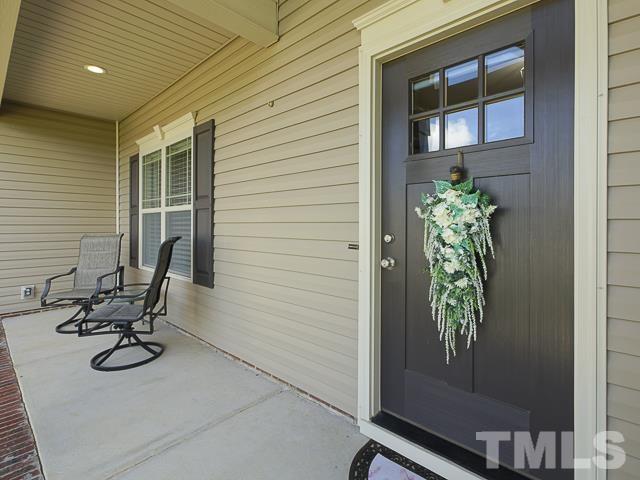 40 Fisher Road Lillington, NC 27546 - Photo 7 of 47 a view of backyard with a chair and potted plant