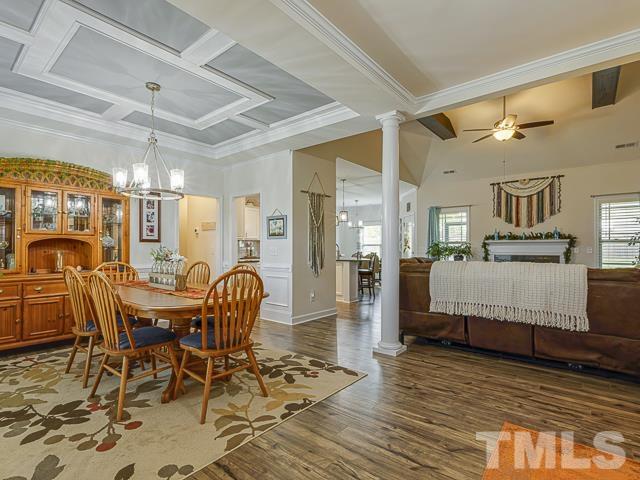 40 Fisher Road Lillington, NC 27546 - Photo 9 of 47 a dining room with furniture a chandelier and wooden floor