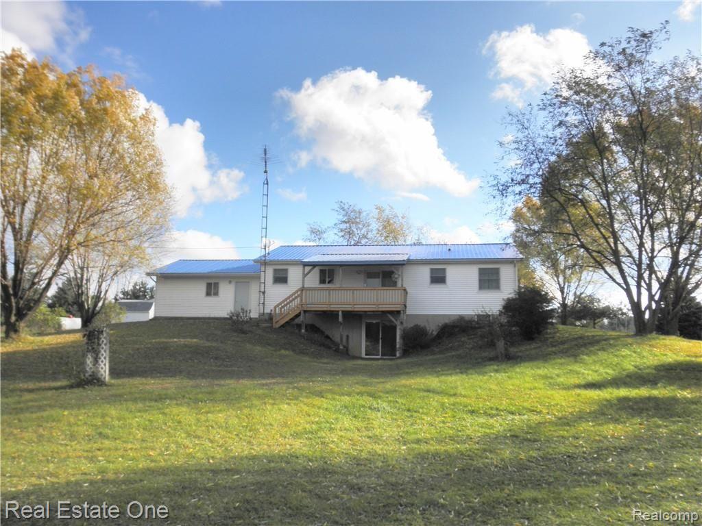 1452 South Crawford Road Deford, MI 48729 - Photo 2 of 49 Rear elevation with walkout basement and covered deck. Note New Steel Roof, 2017, $4,400.