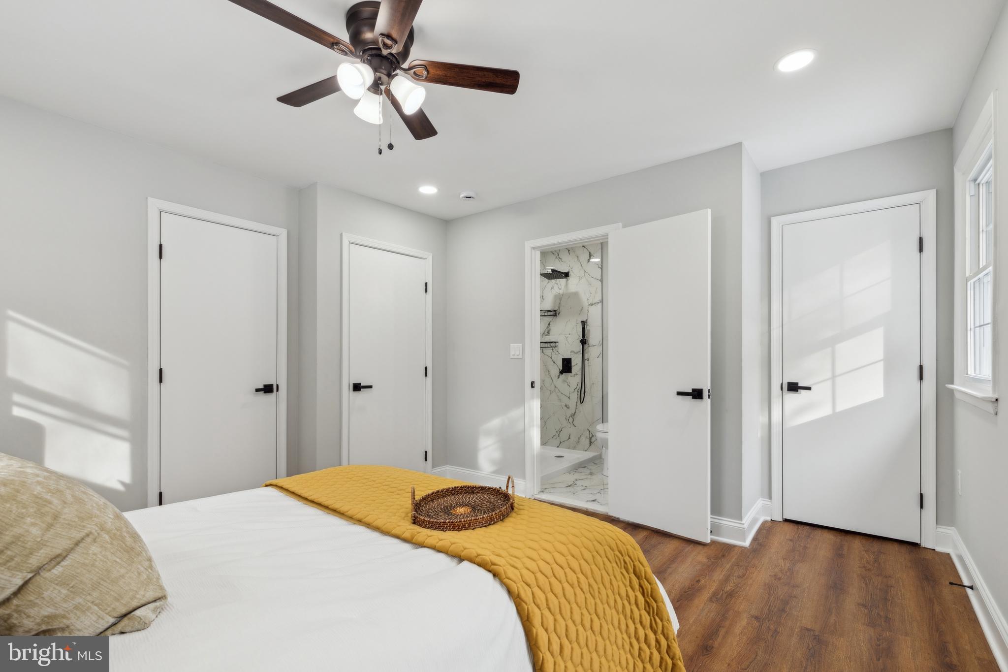 7760 Telegraph Road Severn, MD 21144 - Photo 23 of 49 a bedroom with a bed and a chandelier
