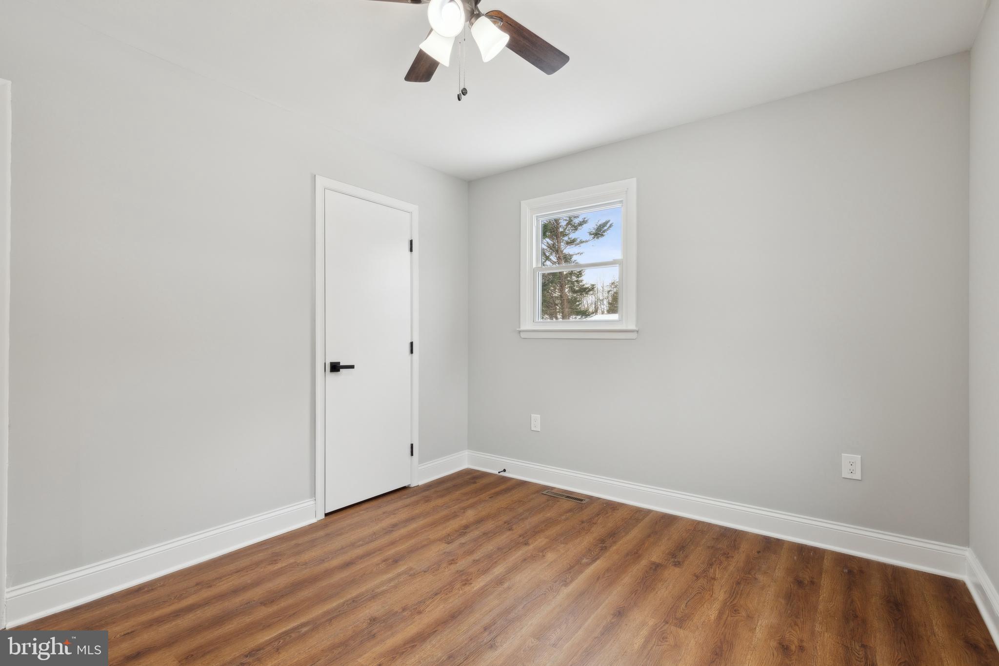 7760 Telegraph Road Severn, MD 21144 - Photo 29 of 49 wooden floor in an empty room