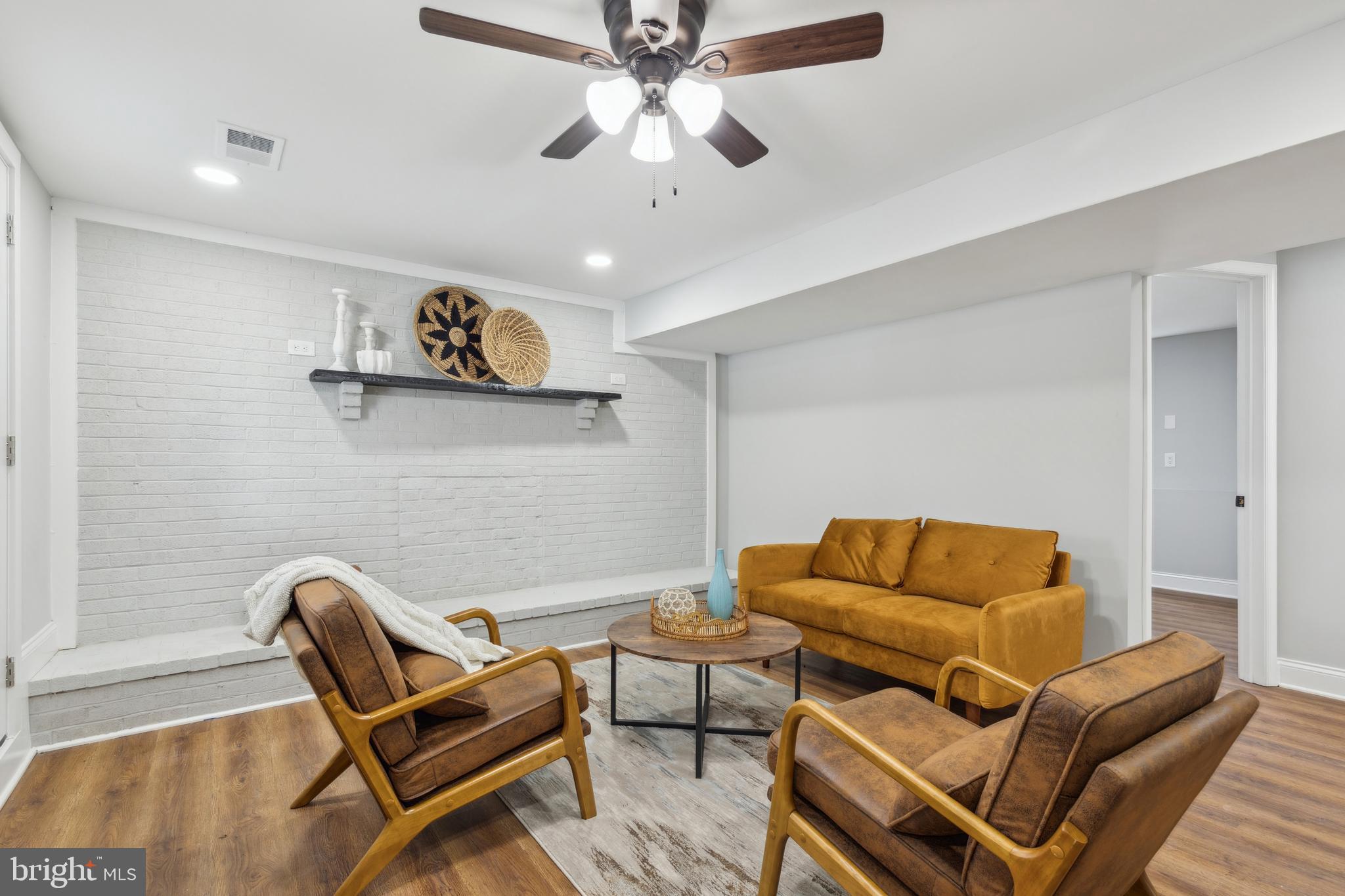 7760 Telegraph Road Severn, MD 21144 - Photo 36 of 49 a living room with furniture and a couch