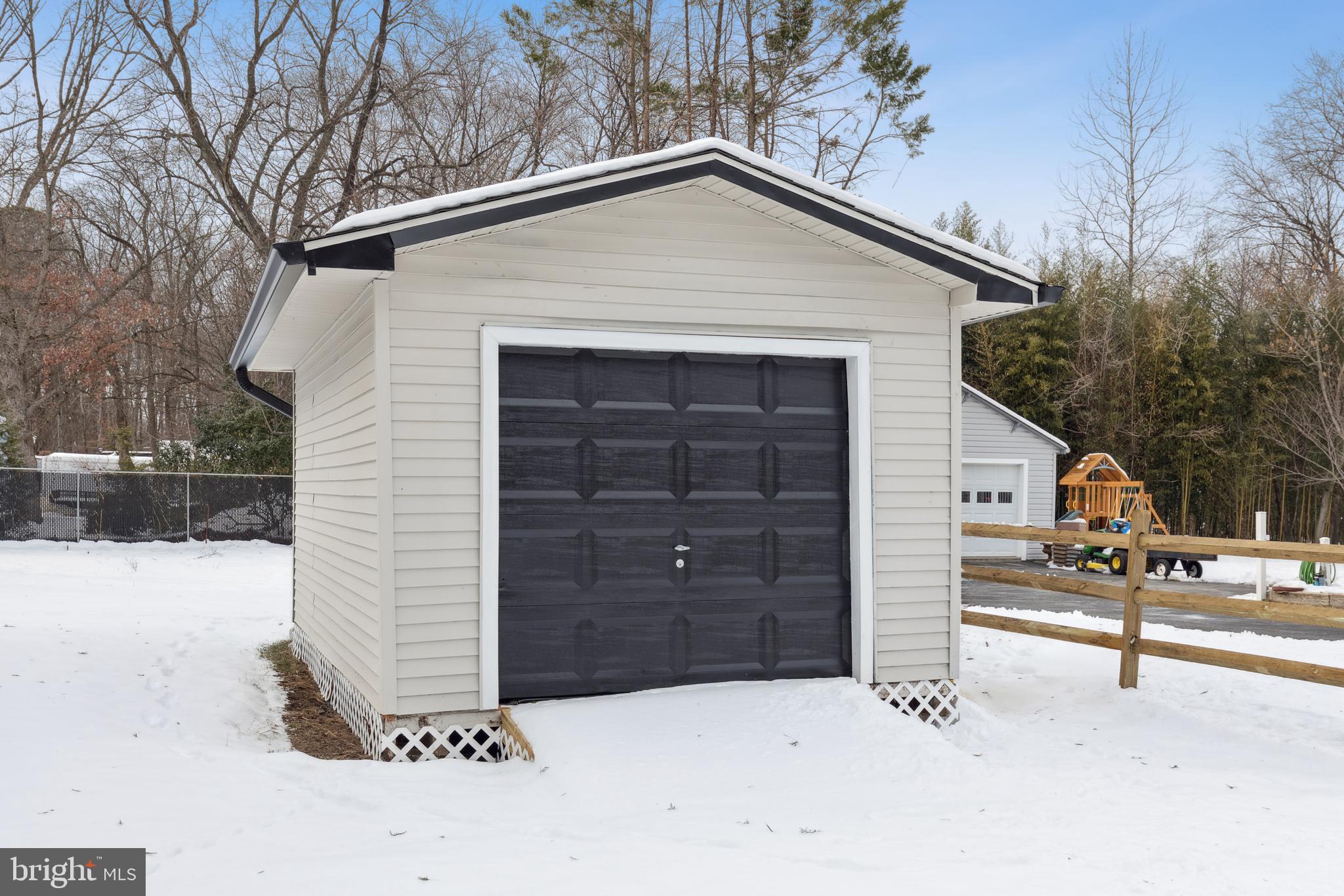 7760 Telegraph Road Severn, MD 21144 - Photo 49 of 49 a front view of a house with a garage