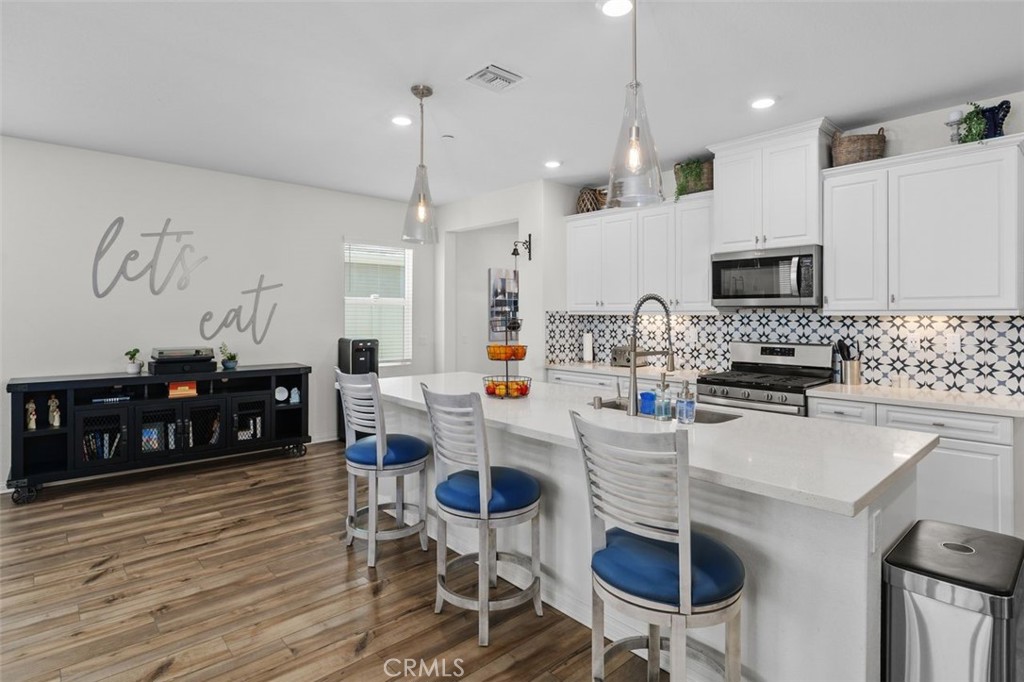 7598 Orangebrook Cove Riverside, CA 92507 - Photo 17 of 45 Open Space Kitchen with Breakfast Bar