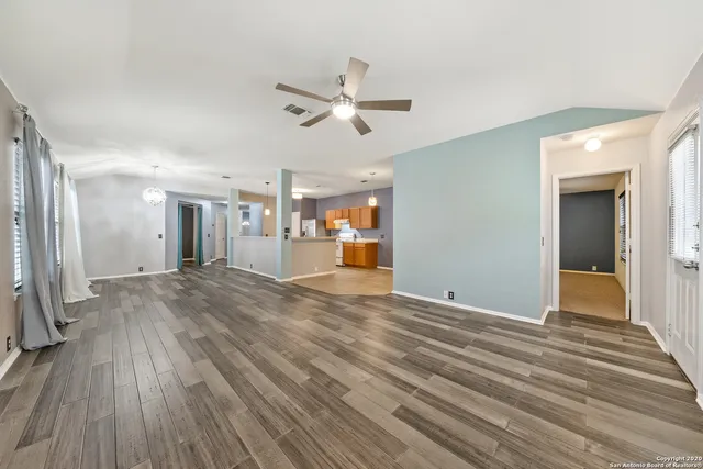 a view of a livingroom with wooden floor