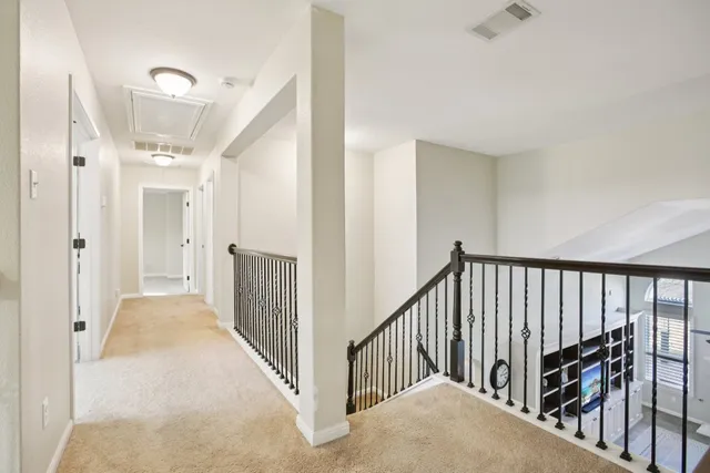 a view of a hallway with staircase