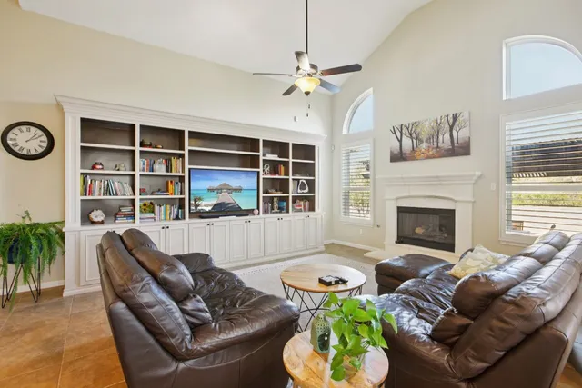 a living room with furniture fireplace and window