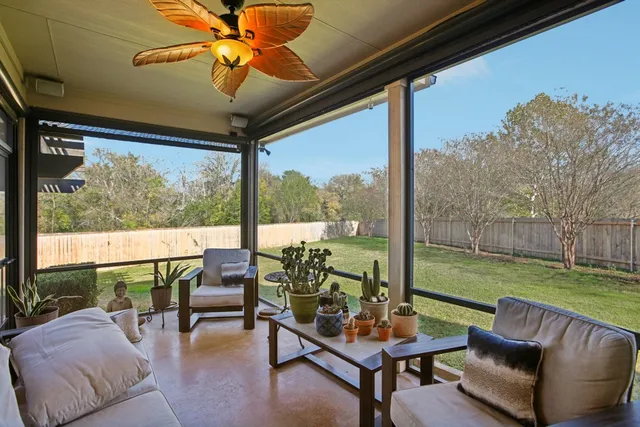 a living room with furniture and a yard