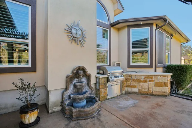 a view of an outdoor sitting area with furniture