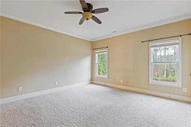 a view of a hallway with windows