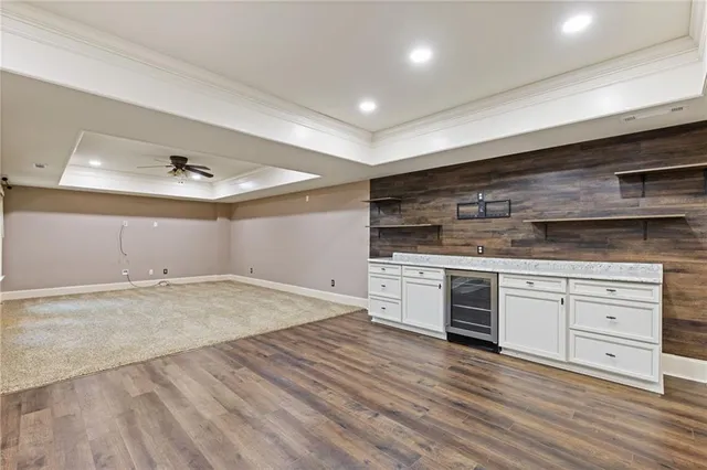 a bathroom with a sink vanity mirror and toilet