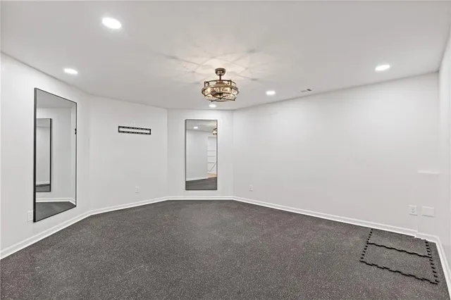 a view of a balcony with wooden floor and fence