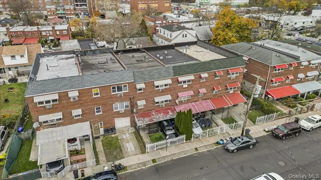 an aerial view of a building with parking