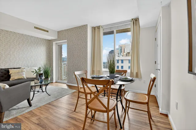 a view of a dining room with furniture and wooden floor