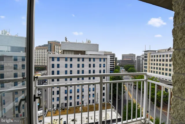 a view of a balcony with city view