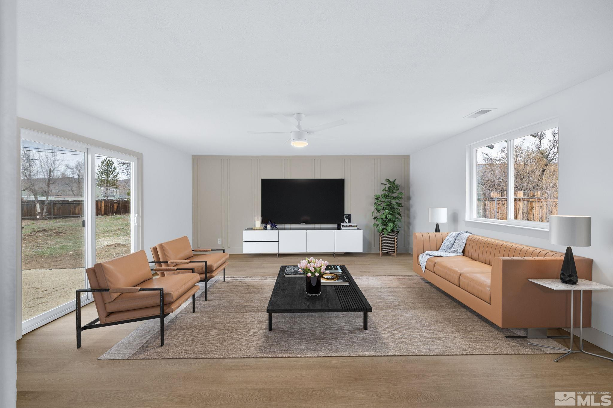 3575 Gull Street Reno, NV 89508 - Photo 12 of 32 a living room with furniture and a flat screen tv