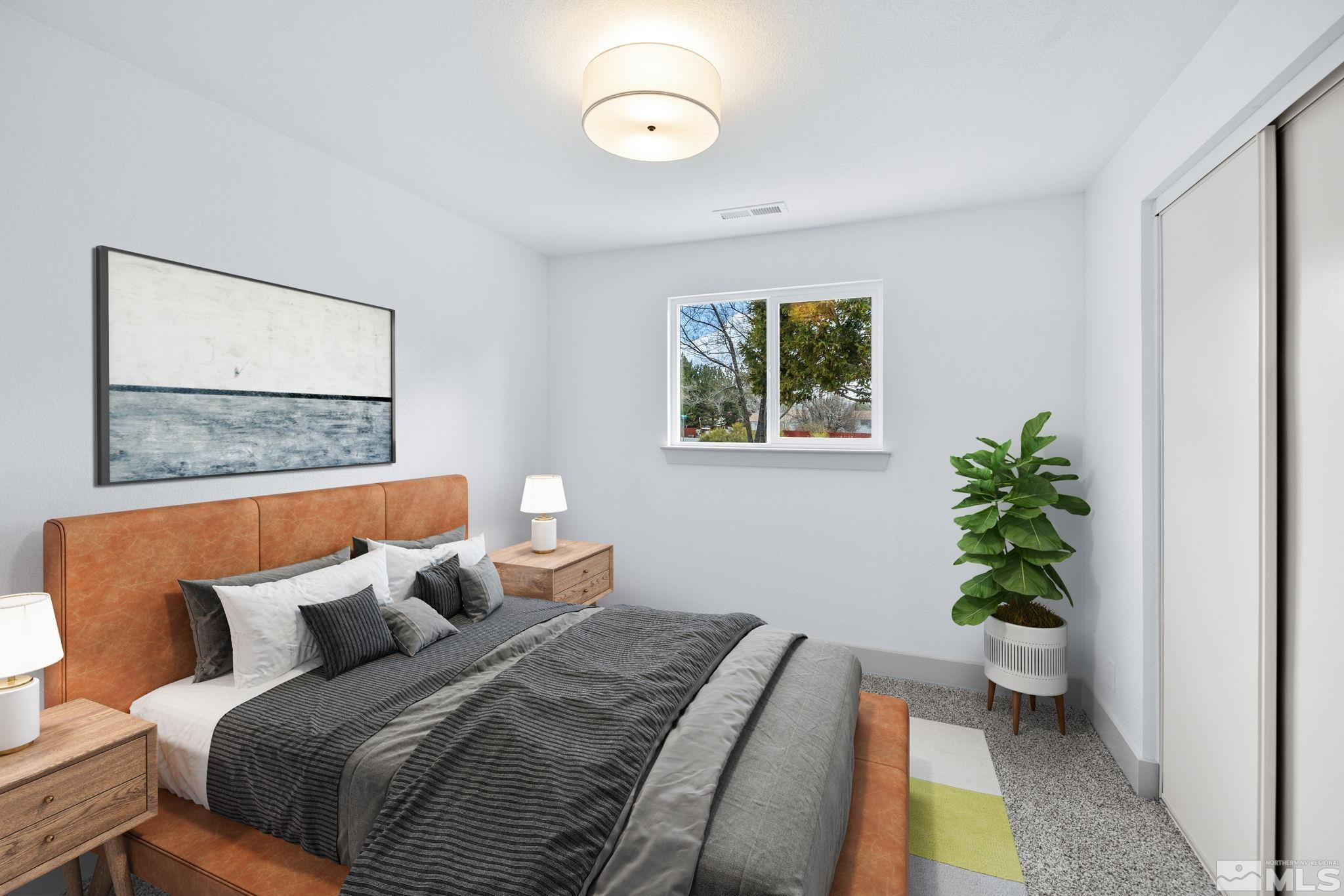 3575 Gull Street Reno, NV 89508 - Photo 22 of 32 a bedroom with a bed and a window